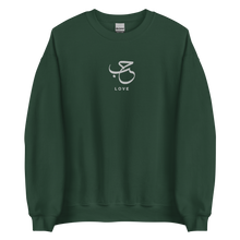 Load image into Gallery viewer, Green unisex sweater featuring ‘Love’ embroidered in elegant Arabic calligraphy. Soft, comfortable, and stylish design perfect for everyday wear.