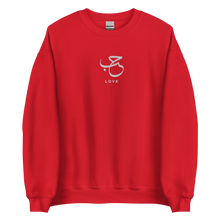 Load image into Gallery viewer, Red unisex sweater featuring ‘Love’ embroidered in elegant Arabic calligraphy. Soft, comfortable, and stylish design perfect for everyday wear.