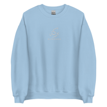 Load image into Gallery viewer, Light blue unisex sweater featuring ‘Blessings’ embroidered in elegant Arabic calligraphy. Soft, comfortable, and stylish design perfect for everyday wear.