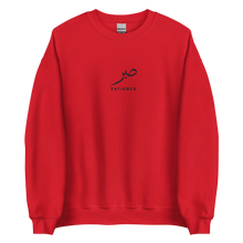 Load image into Gallery viewer, Red unisex sweater featuring ‘Patience’ embroidered in elegant Arabic calligraphy. Soft, comfortable, and stylish design perfect for everyday wear.