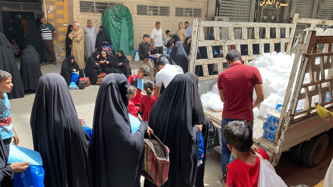 women and orphans receiving their parcels
