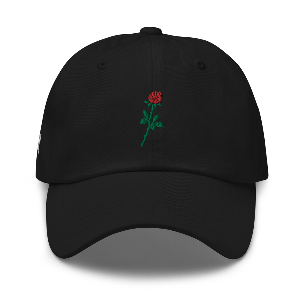 Sabr.Style classic black dad hat featuring the 'Rose of Resistance' design—an embroidered rosebud shaped like a fist, symbolizing strength and defiance. Adjustable strap and curved visor for a comfortable fit.