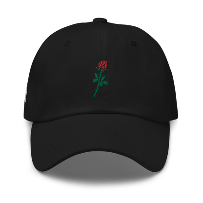 Sabr.Style classic black dad hat featuring the 'Rose of Resistance' design—an embroidered rosebud shaped like a fist, symbolizing strength and defiance. Adjustable strap and curved visor for a comfortable fit.